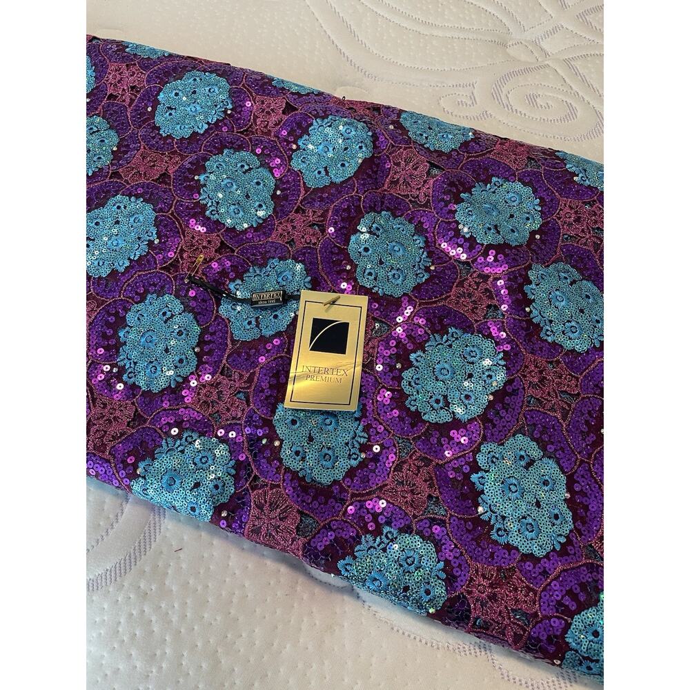 Vibrant purple and turquoise fabric adorned with sequins and floral patterns 5yd